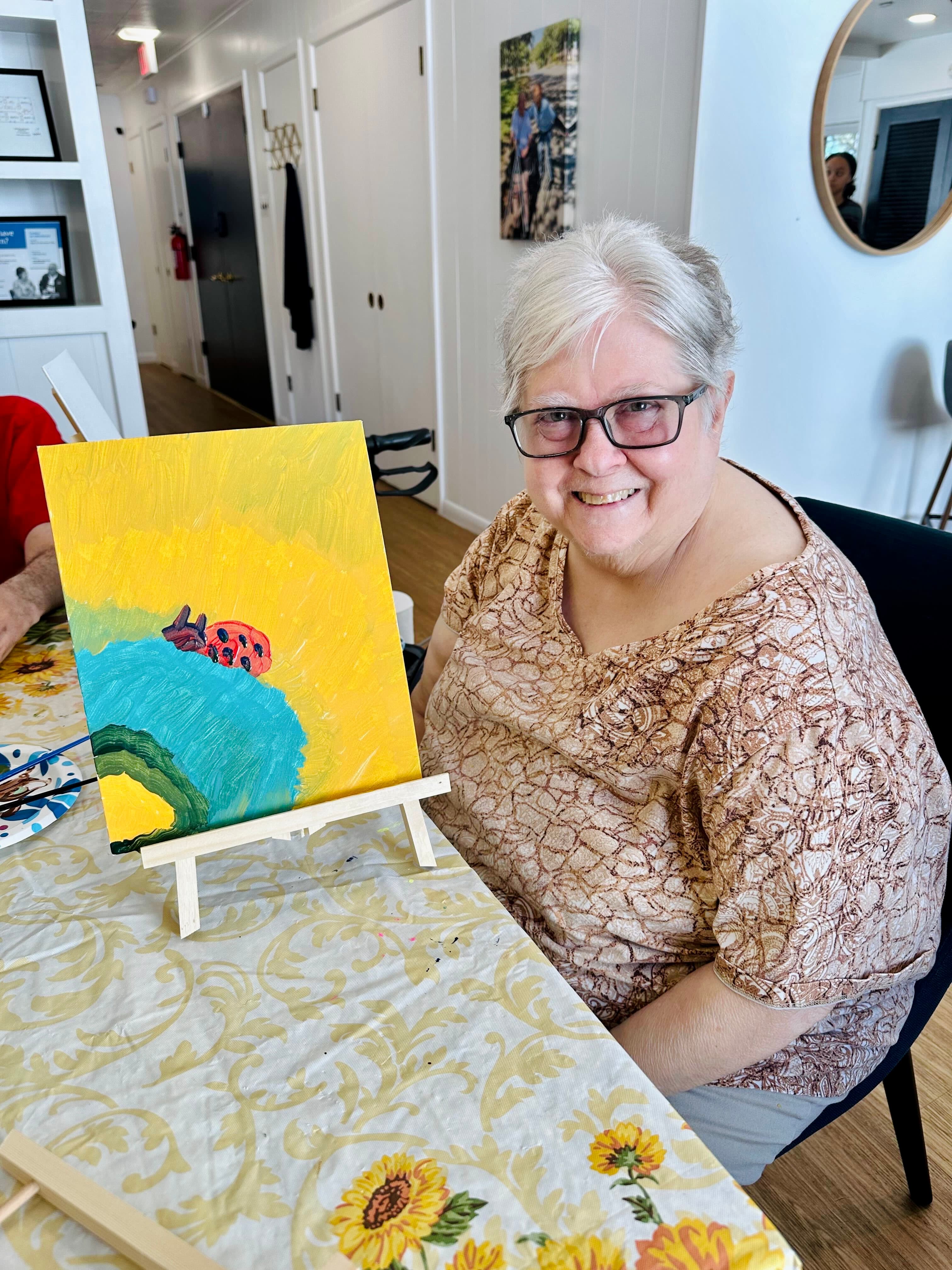 A resident engaged in a hands-on activity at Timeless Care Homes