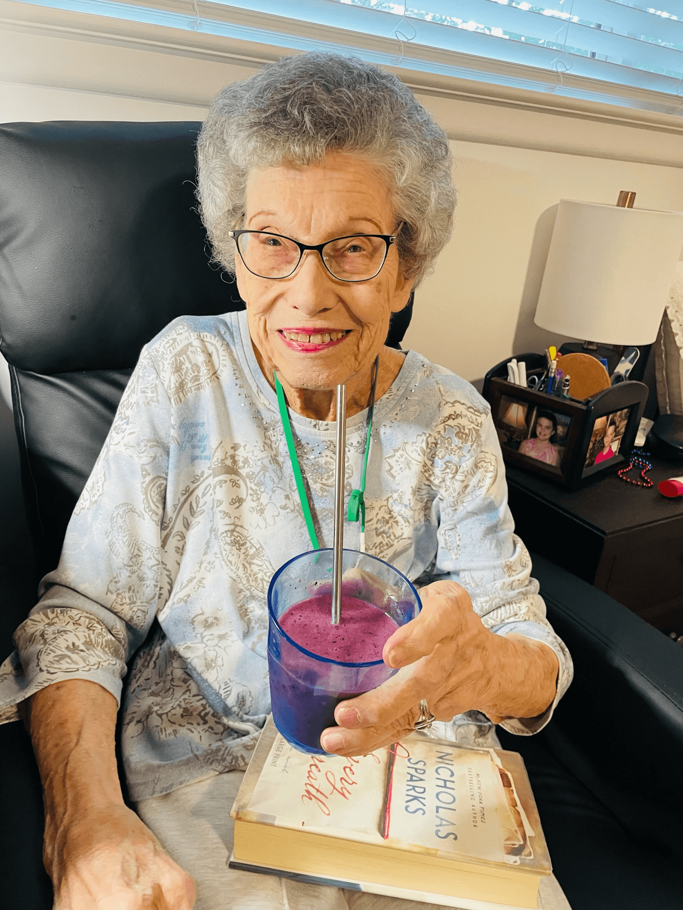 A resident enjoying a healthy smoothie at Timeless Care Homes